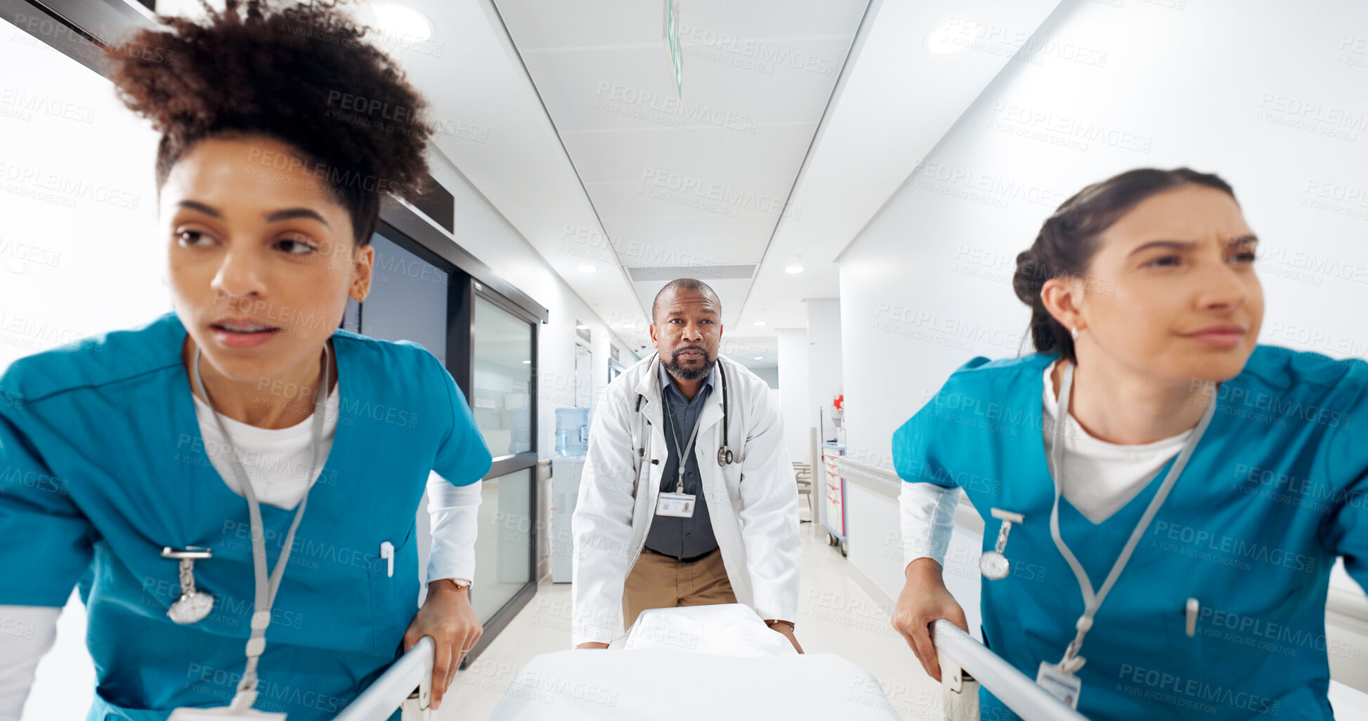 Buy stock photo Running, hospital and doctors with bed in hallway for emergency, surgery and help for medical service. Healthcare, er and people rush with stretcher for accident, operation or surgical treatment