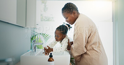 Buy stock photo Hygiene, helping and black mother with kid for washing hands in bathroom for learning. Happy, teaching and African mom with girl for cleaning skin for prevention of bacteria, dirt or dust in home.