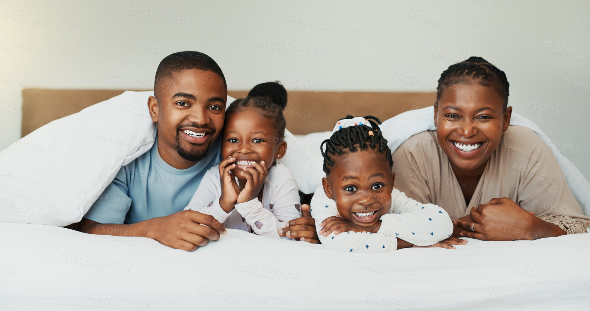 Buy stock photo Relax, smile and portrait with black family in bedroom for bonding, support and trust. Happiness, morning and wake up with parents and children at home for love, care and connection together