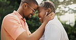 Outdoor, black couple and smile with love for commitment, connection and bonding together in marriage. Nature, man and woman with embrace for admiration, affection and support in healthy relationship