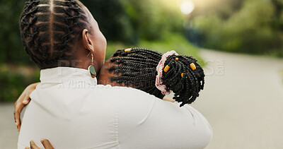 Buy stock photo Mother, kid and hug outdoor for love, care or bonding together with family for connection. African parent, girl and embrace child at park with mama for support, trust or reunion with daughter on road
