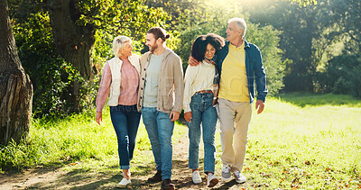 Buy stock photo Happy couple, walking or senior parents in park for bonding with love, relationship connection or hug in retirement. People, mature mother or father with care or family support in nature on holiday