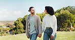 Love, holding hands and smile with interracial couple in park for relax, date and romance. Happiness, walking and marriage with man and woman in nature for commitment, loyalty and bonding together