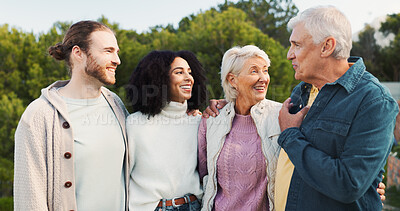 Buy stock photo Nature, couple and parents with hug for laughing, funny conversation or bonding together as family. Park, men and women with happiness for love embrace, relationship and connection on weekend holiday