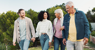 Buy stock photo Outdoor, couple and parents with holding hands for laughing, conversation or bonding together as family. Park, man and woman with senior people for love, relationship or connection on weekend holiday