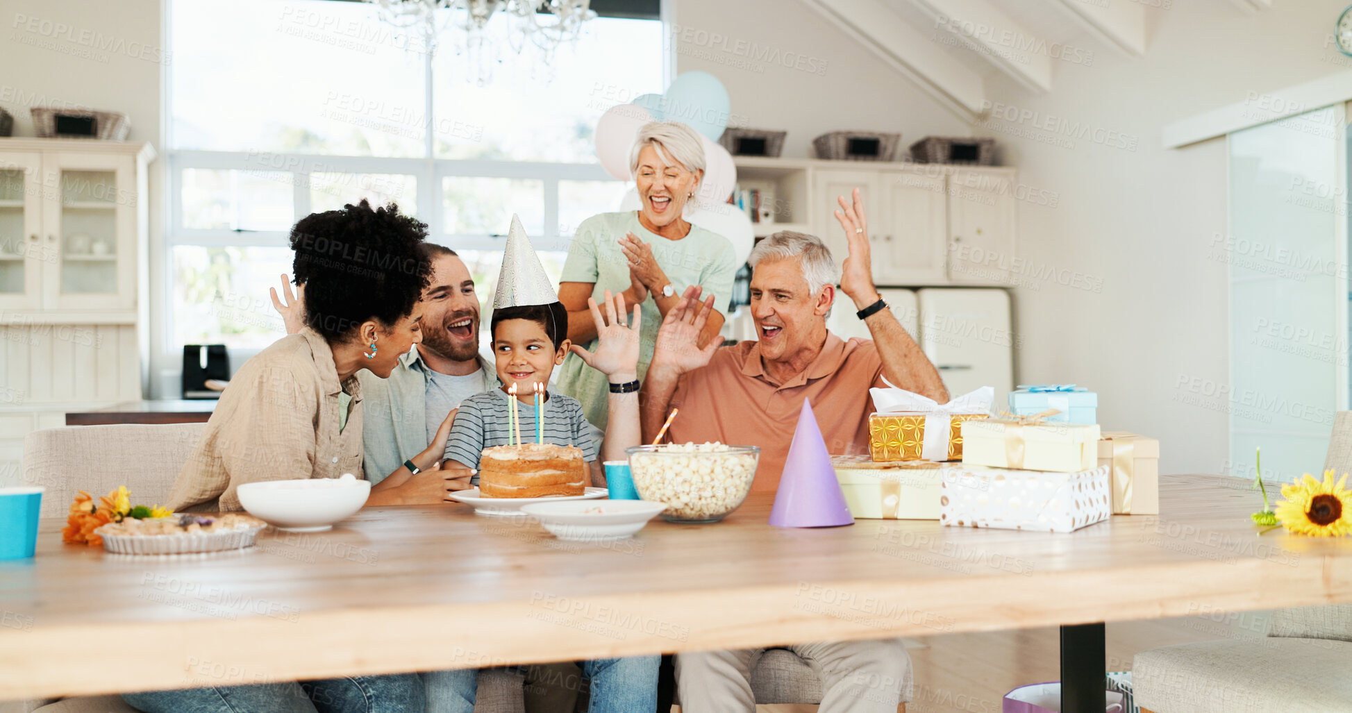 Buy stock photo Birthday, home and parents with child celebrate at lunch party, gathering and event together for surprise. Family, grandparents and happy boy, mom and dad with dessert, candles and cake in house