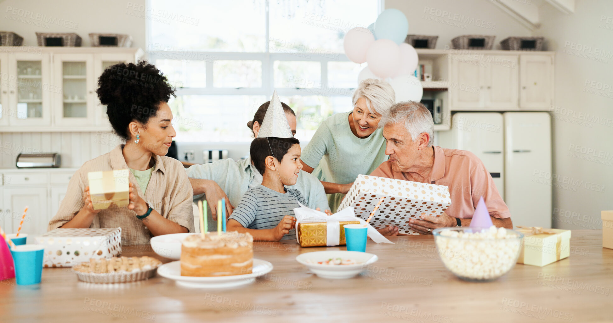 Buy stock photo Birthday, presents and parents with child and cake for lunch party, celebration and event together. Family, grandparents and happy boy, mom and dad with dessert, candles and food for surprise in home
