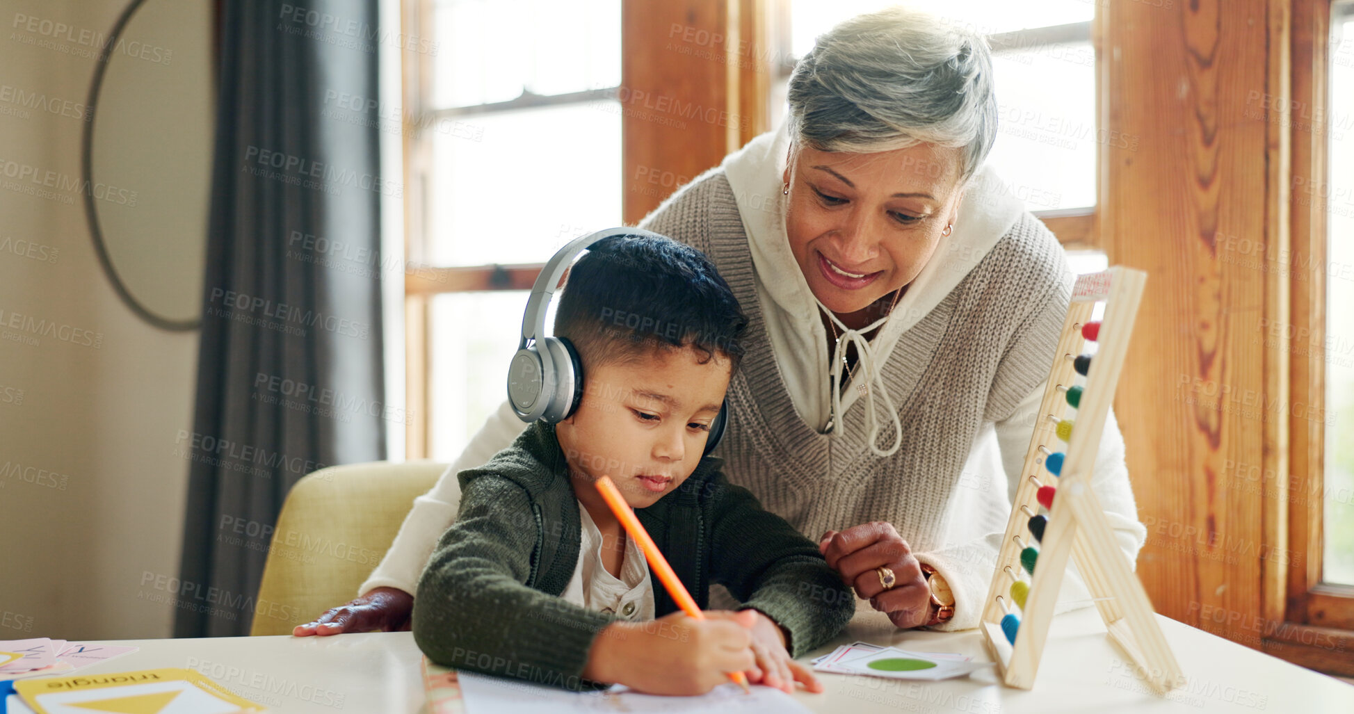 Buy stock photo Writing, woman and child with headphones, teaching and listening to podcast for knowledge and abacus. Studying, student and kid with audio for homework, growth and development with grandma or numbers