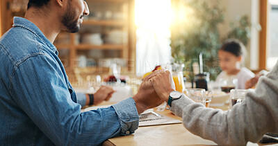 Buy stock photo Meal, family and holding hands in home for prayer, gratitude or holiday brunch in closeup for feast. Group, support or people at table together for sharing supper, lunch or food in house for grace
