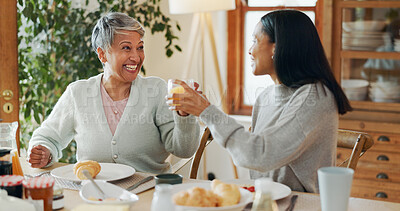Buy stock photo Home, breakfast and senior mother with adult daughter, cheers and bonding together. Family, parent and women with juice, healthy food or nutrition with announcement, good news and happiness with love