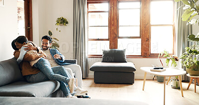 Buy stock photo Parents, girl and happy for hug on sofa, playful and bonding with care in living room at apartment. Father, mother and daughter with embrace, love and excited with childhood memory in family house