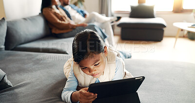Buy stock photo Home, child and girl with tablet for streaming, watch movies and online game with technology. Couch, parents and kid with digital for video application, cartoon and ebook on website in living room