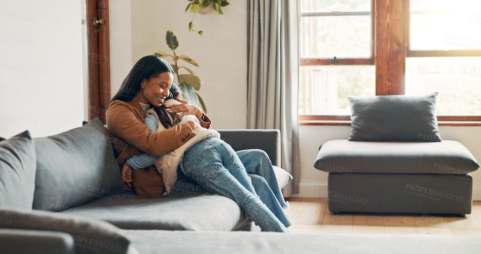 Buy stock photo Hug, love and mother with daughter on sofa for bonding, care and embrace together. Support, happiness and connection with woman and child in living room of family home for commitment, relax or growth
