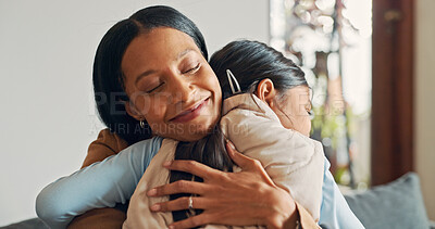Buy stock photo Smile, mother and girl on sofa for hug, connection and bonding together as family at home. Couch, affection and mom with child for love embrace, relationship and relax on weekend holiday in house