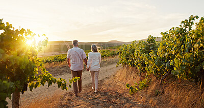 Buy stock photo Love, walking and holding hands with old couple in vineyard for romance, anniversary date and bonding. Sunset, retirement and support with senior man and woman at winery for space, back and vacation