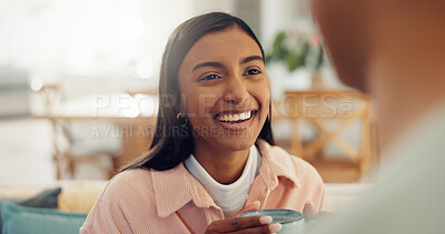 Buy stock photo Coffee, laugh and woman in home for talking, conversation and discussion for news on weekend. House, morning and couple with drink for bonding, relationship and happy for relaxing, chill and chatting