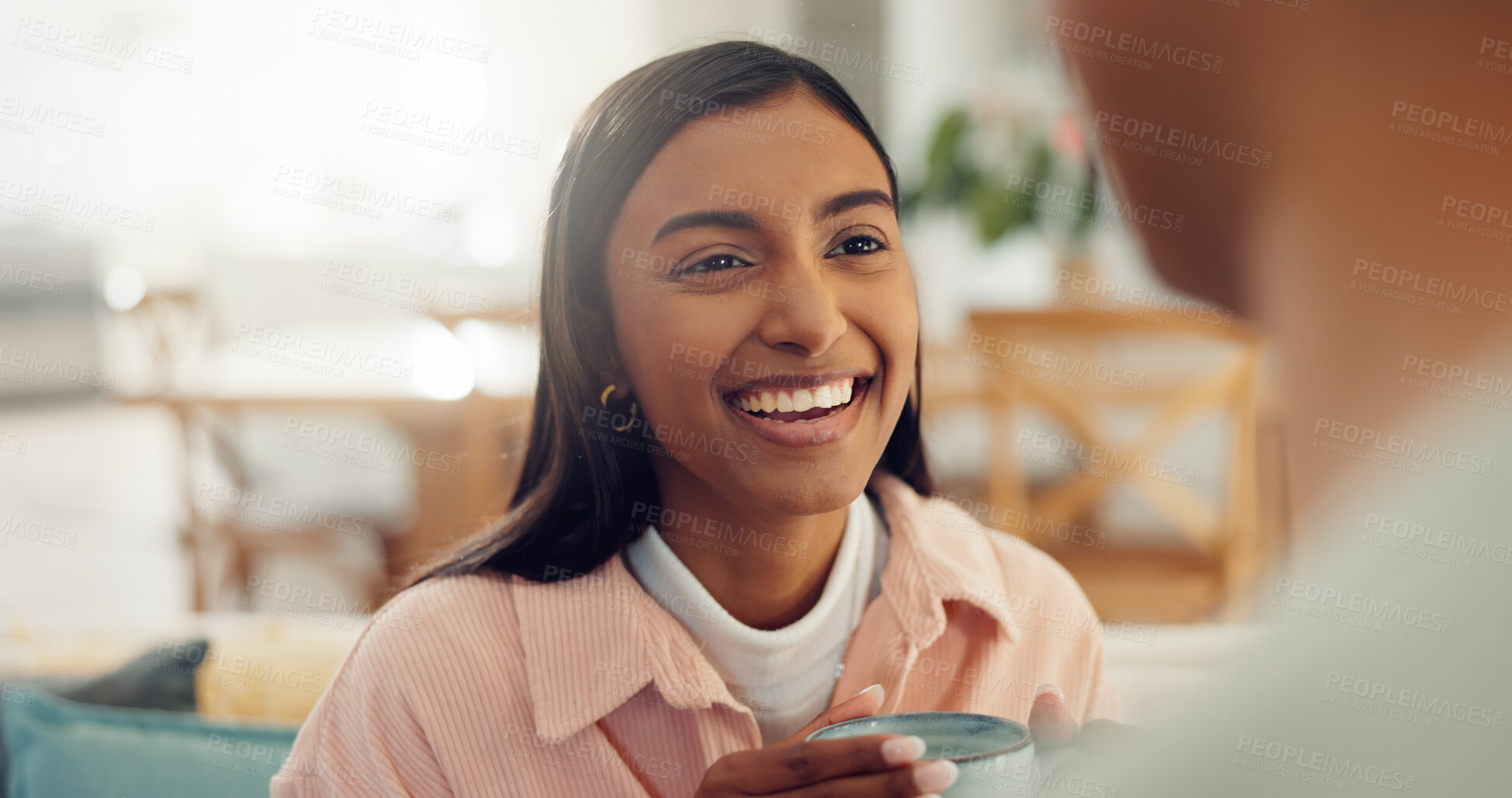 Buy stock photo Coffee, laugh and woman in home for talking, conversation and discussion for news on weekend. House, morning and couple with drink for bonding, relationship and happy for relaxing, chill and chatting