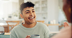 Coffee, happy and man in home for talking, conversation and discussion for news on weekend. House, morning and couple with drink for bonding, relationship and smile for relaxing, chill and chatting