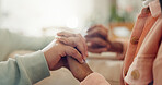 Empathy, holding hands and trust with couple closeup in home together for bonding, love or trust. Connection, healing or support and people in apartment for help with trauma of grief, loss or pain