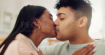 Buy stock photo Couple, relax and kiss with love at house for affection, passion and partner for support in living room. People, romance and bonding together for relationship commitment, connection and weekend break