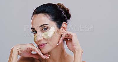 Buy stock photo Skincare, woman and eye patches in studio for puffiness reduction, collagen treatment and hyaluronic acid. Mockup, mature person and portrait with beauty product for dark circles on white background