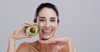 Buy stock photo Happy, skincare and portrait of woman with avocado for beauty, cosmetics and facial treatment in studio. Dermatology, spa and person for vitamins, organic and natural benefits on white background