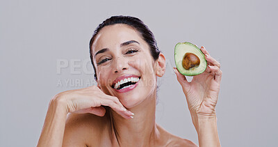 Buy stock photo Wellness, skincare and portrait of woman with avocado for beauty, cosmetics and facial treatment in studio. Dermatology, spa and person for vitamins, organic and natural benefits on white background
