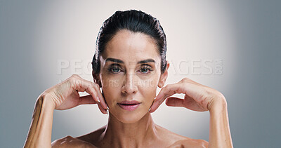 Buy stock photo Dermatology, portrait and skincare with woman in studio for antiaging treatment or wellness routine. Aesthetic, beauty and cosmetics with mature model on gray background for facial transformation