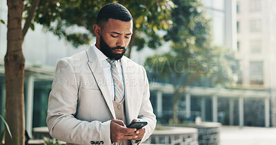 Buy stock photo Business man, phone and outdoor in city for travel with law career, internet or network connection. Serious, lawyer and online for typing legal advice, mobile app or text contact for deal by court