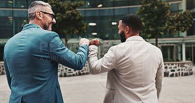 Buy stock photo Business people, fist bump and team celebrate outdoor in city for success, win or deal bonus. Back of men, friends or corporate colleagues together for gesture, partnership or excited for opportunity