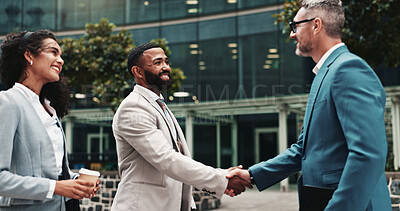 Buy stock photo Business people, handshake and meeting outdoor in city for discussion, introduction or deal. Happy men, woman or corporate partners together for onboarding, agreement or networking for urban work