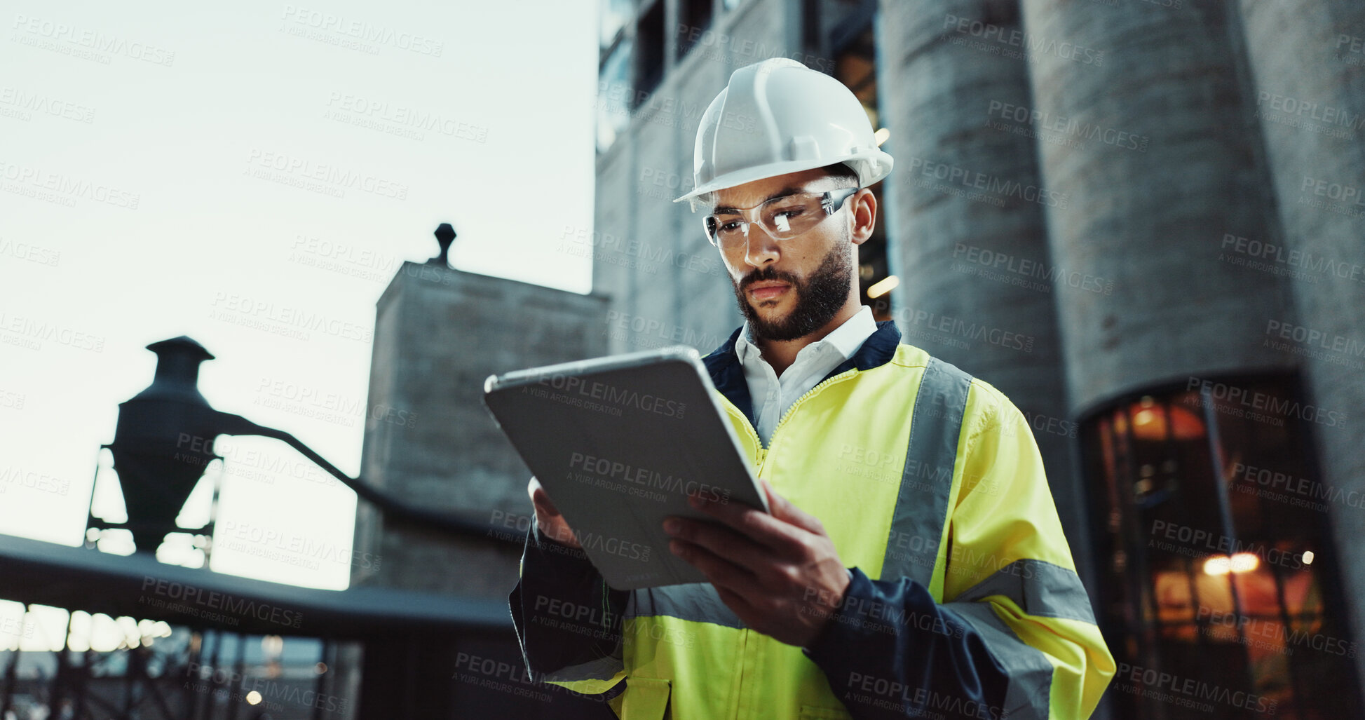 Buy stock photo Tablet, architect and serious man in city for construction, planning and low angle at dawn. Technology, building and engineer outdoor for maintenance, safety inspection and infrastructure project