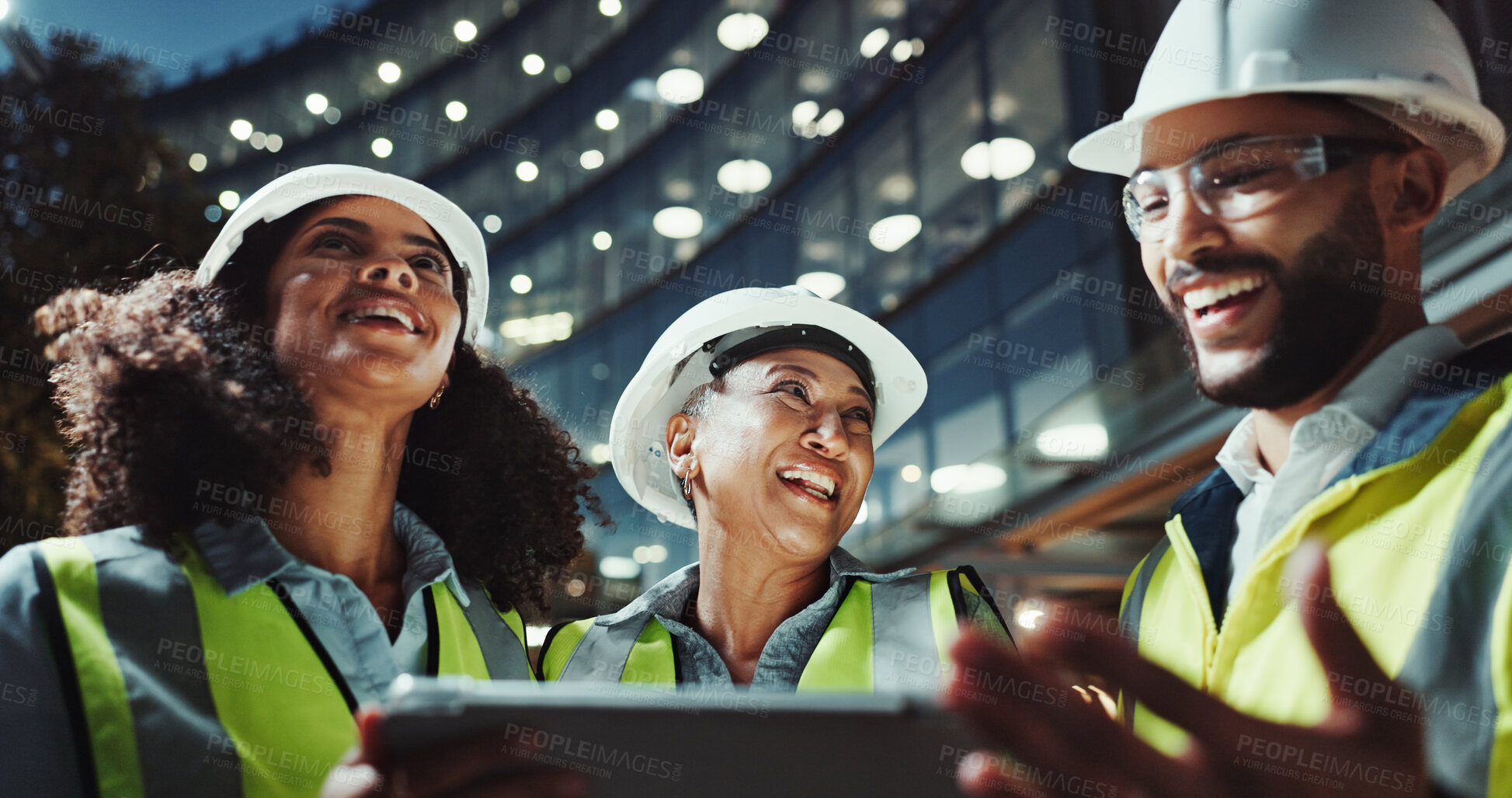 Buy stock photo Night, engineering and people with tablet, funny and conversation with connection. Group, laughing and employees with technology, evening and online planning for construction, humor and discussion