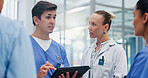Man, doctors and tablet with team at hospital with discussion for funding, management and review. People, leader and group with surgeon, problem solving and feedback with app at wellness clinic