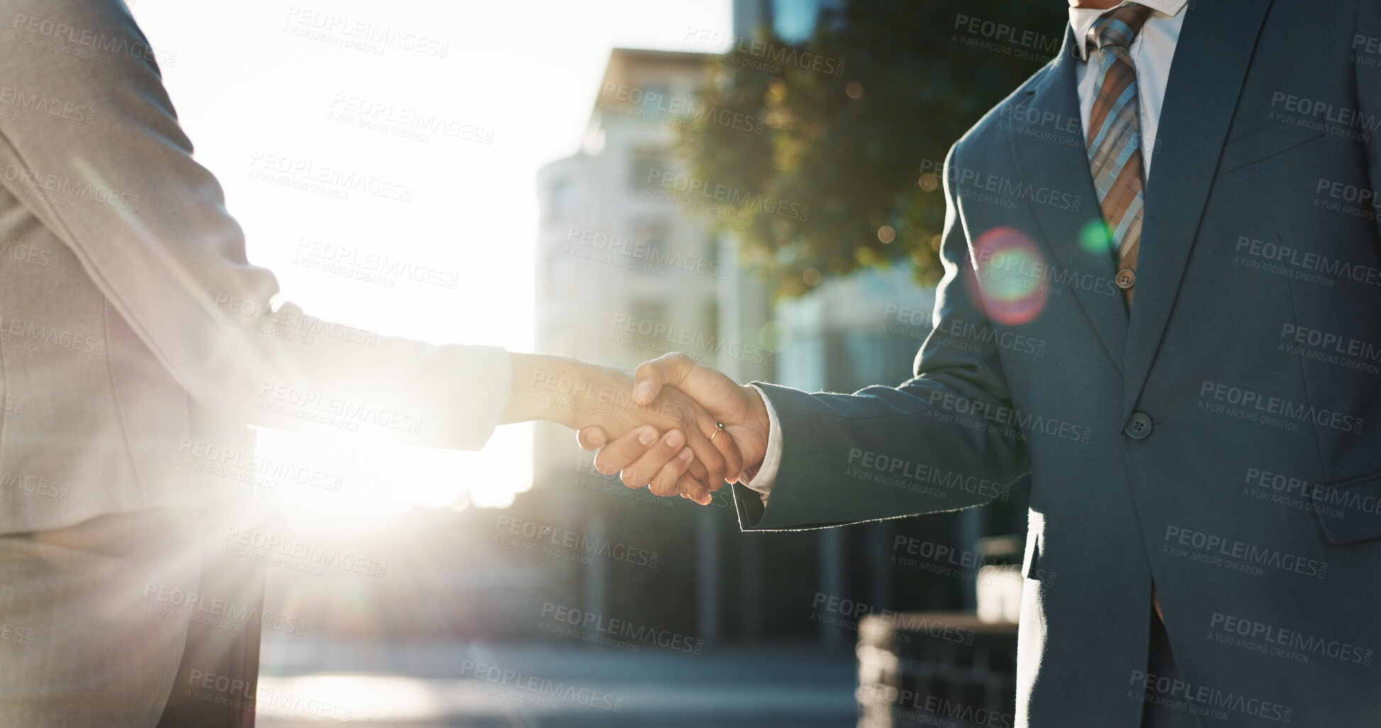Buy stock photo Handshake, meeting and welcome with business people in city for agreement, success and b2b deal. Teamwork, partnership and shaking hands with employees downtown for introduction