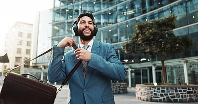 Buy stock photo Bag, music and business man in city with morning audio, thinking and streaming radio for travel. Headphones, outdoor and happy employee listening to song, podcast and dancing to sound on commute