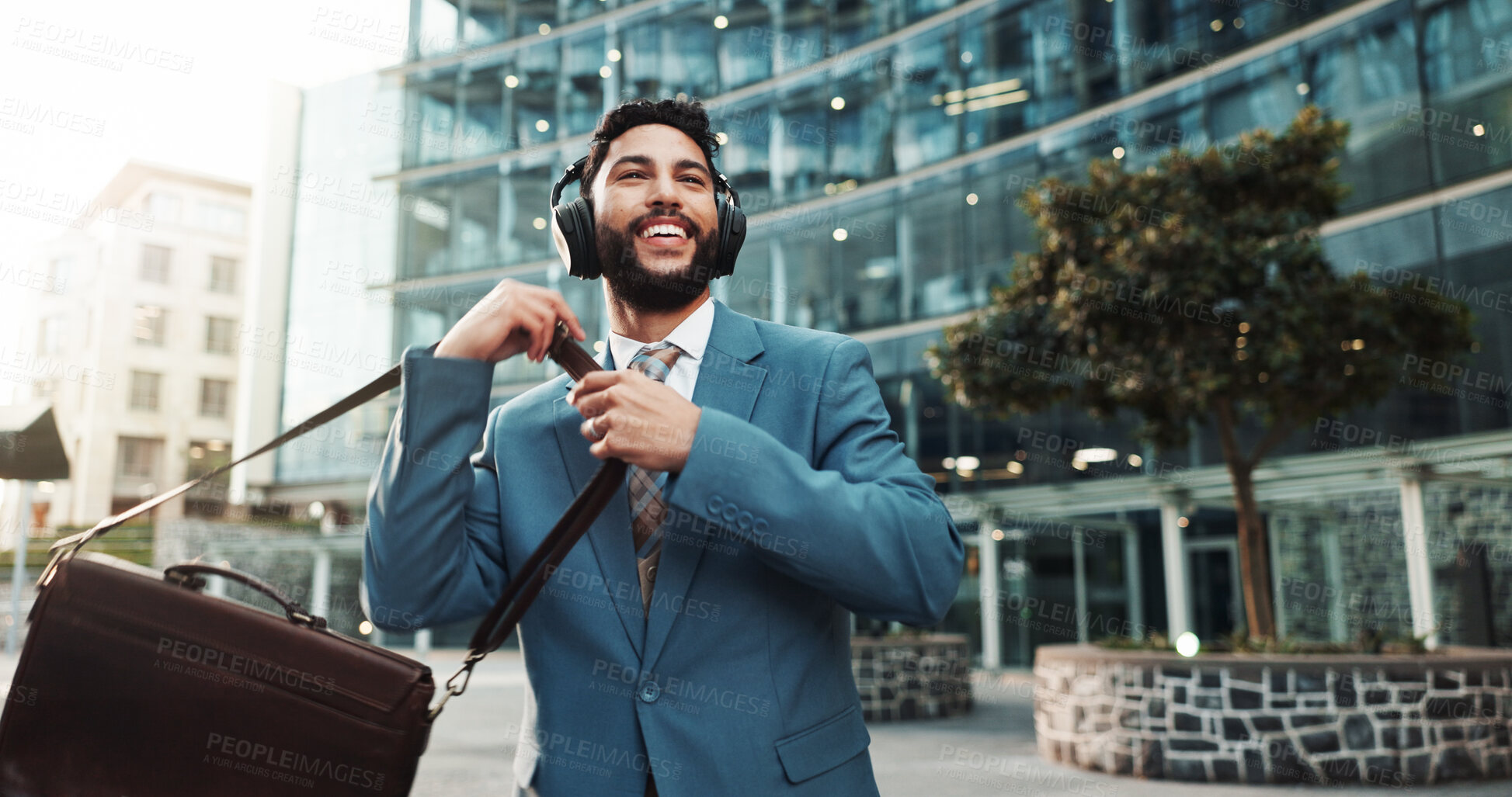 Buy stock photo Bag, music and business man in city with morning audio, thinking and streaming radio for travel. Headphones, outdoor and happy employee listening to song, podcast and dancing to sound on commute