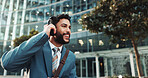 Headphones, audio and business man outdoor with morning playlist and streaming radio for travel. Music, city and happy employee listening to song, corporate podcast and thinking of sound on commute