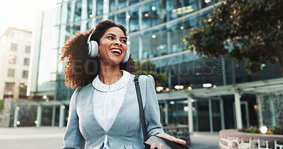 Buy stock photo Commute, laughing and music with businesswoman in city for idea, inspiration or travel. Building, headphones and vision with funny corporate professional outdoor in urban town for start of new job