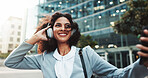 Selfie, music and business woman in city with wind, morning audio and streaming radio for travel. Headphones, outdoor and happy employee listening to song, podcast and think of photography on commute