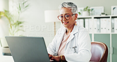 Buy stock photo Laptop, woman and doctor in office, research for diagnosis and test results with treatment. Mature person, medical or professional in workplace, computer or email with internet, healthcare or smile