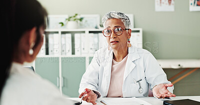 Buy stock photo Appointment, checkup or healthcare with doctor and patient in office of hospital for consulting. Conversation, feedback or medical with mature medicine professional and woman in clinic for treatment
