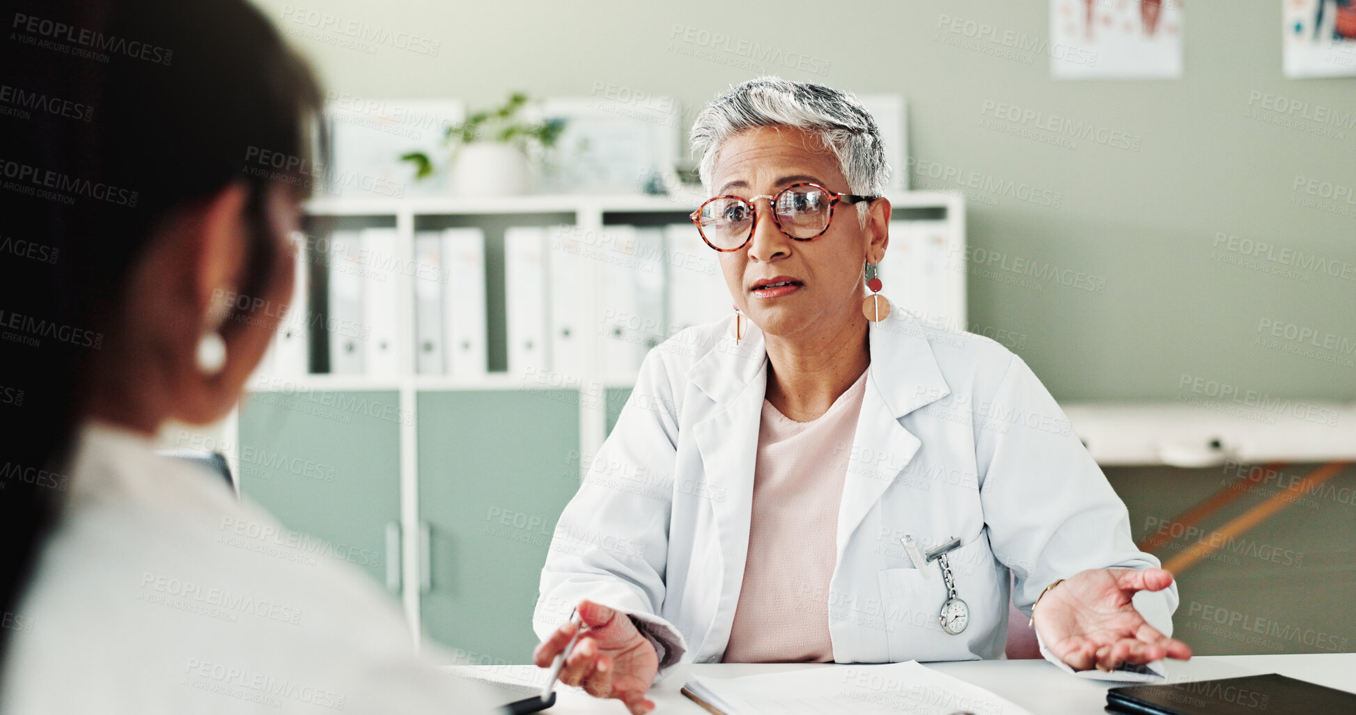 Buy stock photo Appointment, checkup or healthcare with doctor and patient in office of hospital for consulting. Conversation, feedback or medical with mature medicine professional and woman in clinic for treatment