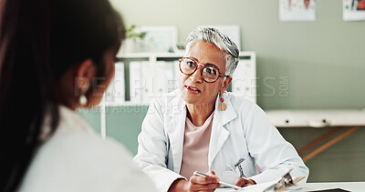 Buy stock photo Checkup, clipboard or healthcare with doctor and patient in office of hospital for consulting. Appointment, documents or insurance with mature medical professional and woman in clinic for treatment