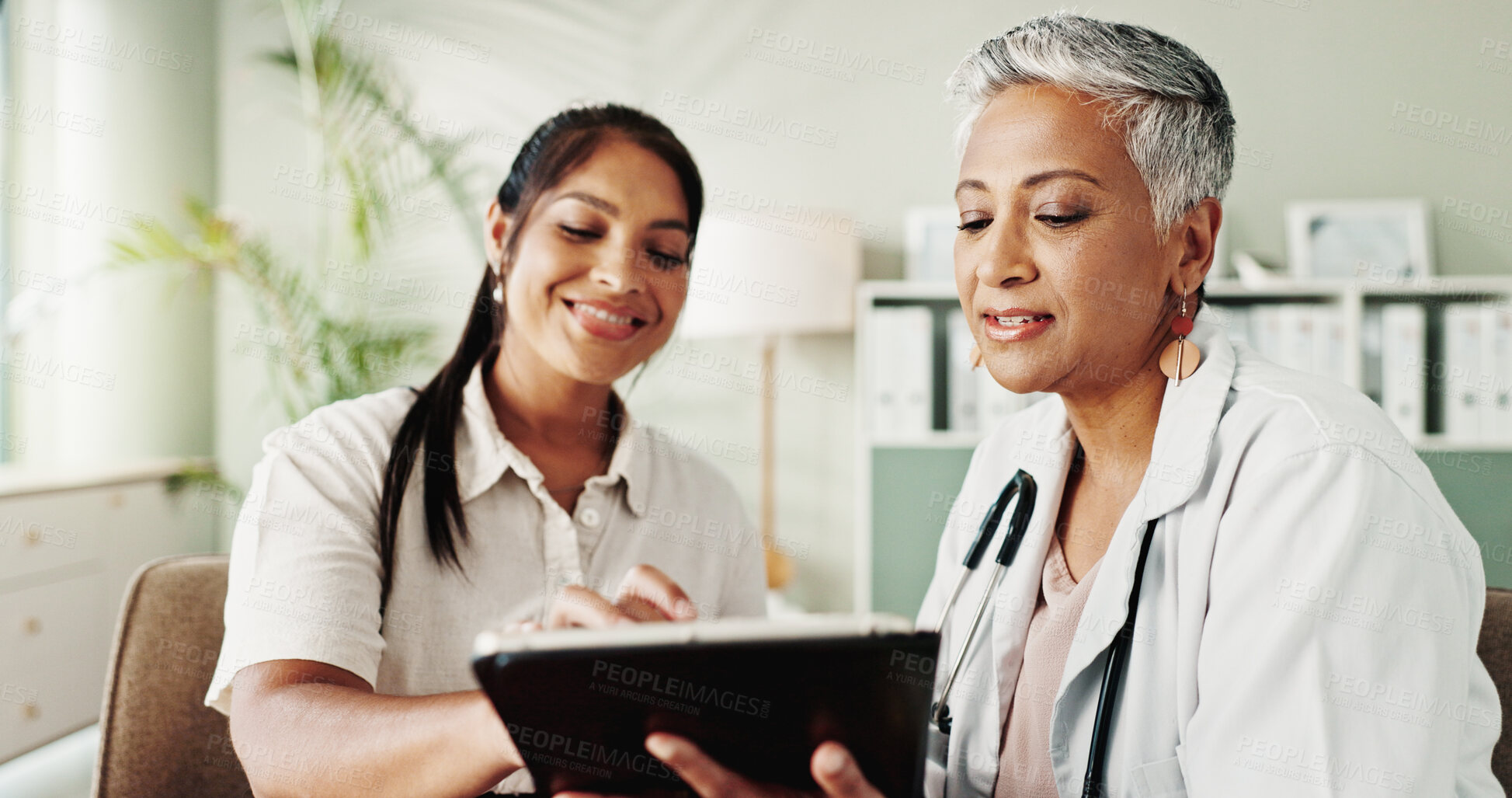 Buy stock photo Smile, woman and mature doctor on tablet in office for good news, research and online results of diagnosis. People, digital and healthcare report, insurance checklist and treatment plan and medical