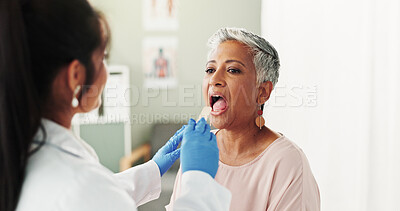 Buy stock photo Clinic, woman and doctor with depressor for tongue, throat assessment and checkup for inflammation. Hospital, senior patient and otolaryngology with inspection for medical care, diagnosis and mouth