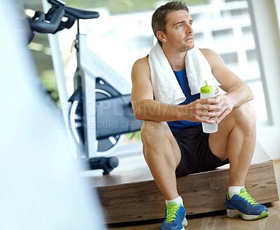 Buy stock photo Fitness, thinking and man with bottle in gym for body wellness, health ideas and water for hydration. Workout, sports and person with drink on break for relax, rest and planning training or recovery