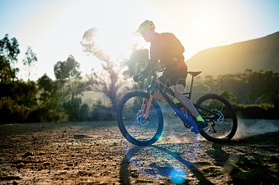 Buy stock photo Cycling, dust and off road with man in mountains for outdoor exercise, fitness or hobby. Bike, speed and trail riding with cyclist person in nature for challenge, performance or sports training