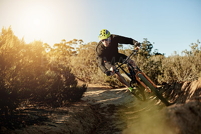 Buy stock photo Mountain bike, cycling and man with dirt road race, workout or cardio exercise in nature. Fitness, triathlon and cyclist on dust trail for sports competition, challenge or training with adventure.