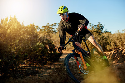 Buy stock photo Mountain bike, cycling and athlete with dirt road race, workout or cardio exercise in nature. Fitness, triathlon and man cyclist on trail for sports competition, challenge or training with adventure.